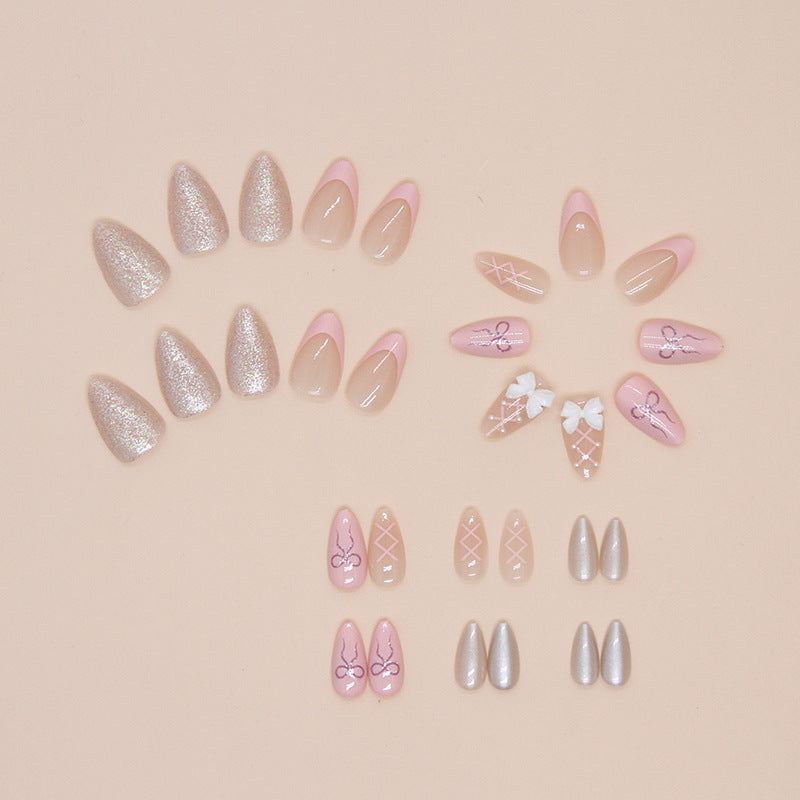 Stylish ballerina nails adorned with intricate designs and a glossy finish, showcasing a modern take on the classic ballerina shape.