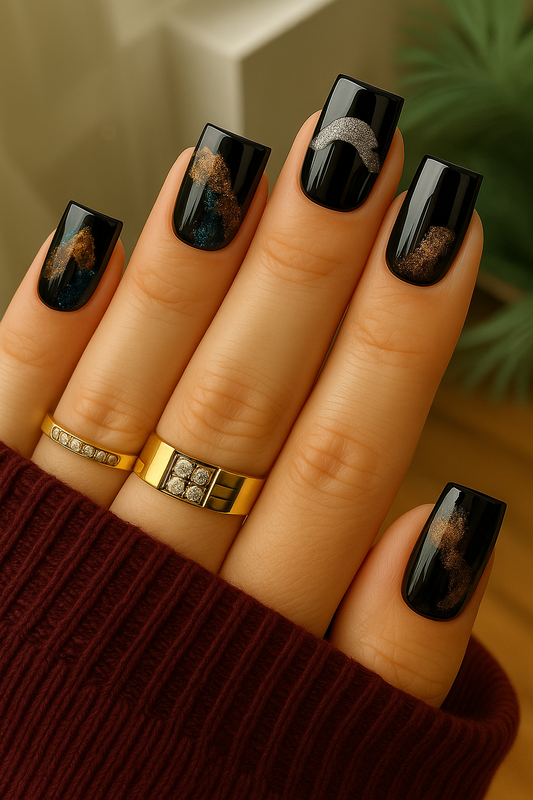 Black press-on nails with glitter masquerade mask art in silver, blue and bronze by Elanto Nails on white background