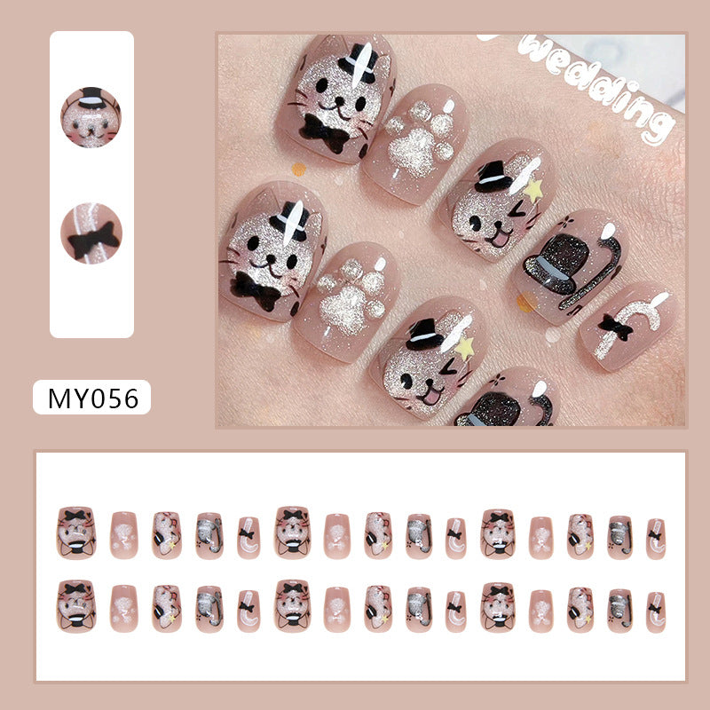 Stylish nails showcasing a mix of cat motifs and vibrant colors, capturing the essence of a playful cat-themed party.