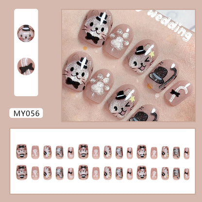 Stylish nails showcasing a mix of cat motifs and vibrant colors, capturing the essence of a playful cat-themed party.