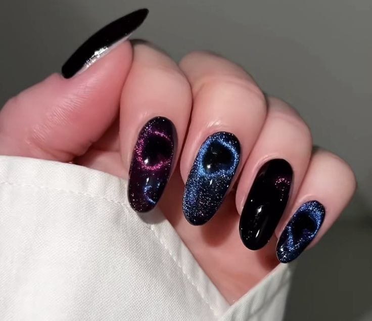 "Stunning Galaxy Heart Cat Eye nails featuring a heart-shaped design and iridescent effects."