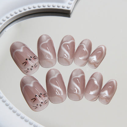 Meow Manicure cat eye nails in a soft skin tone with a subtle shimmer effect, creating a chic and understated feline-inspired look.