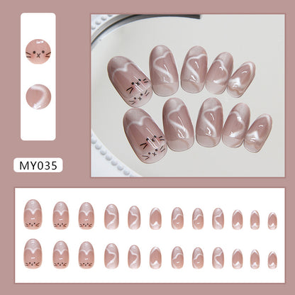 Elegant skin-colored Meow Manicure cat eye nails featuring a delicate, glossy finish that adds a hint of sparkle to a neutral base.