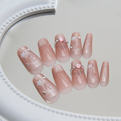 Sparkling Pink Stardust nails featuring a soft pink base with a shimmering stardust effect, perfect for a dreamy and whimsical look.