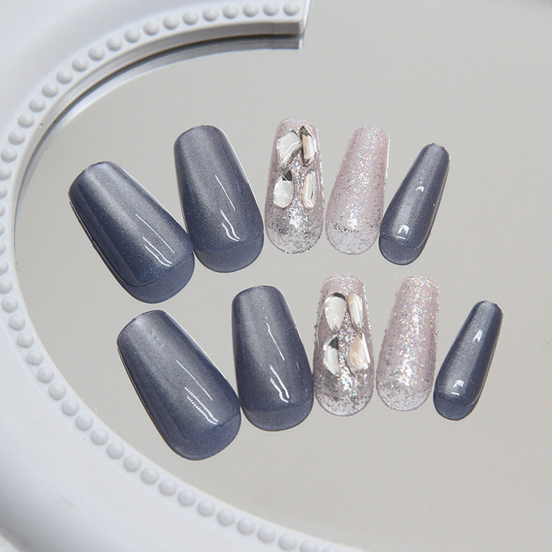 Glossy Twelfth Night grey cat eye nails with a soft, velvety glow, adding depth to any outfit.