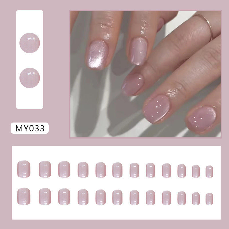 Baby pink cat eye nails featuring a soft pink base with a subtle cat eye effect that creates a gentle, reflective shimmer.