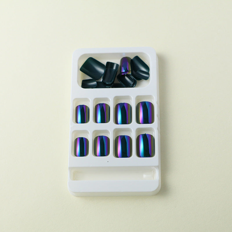 "Unique Beetle Green Chrome press-on nails with a high-shine, metallic effect."