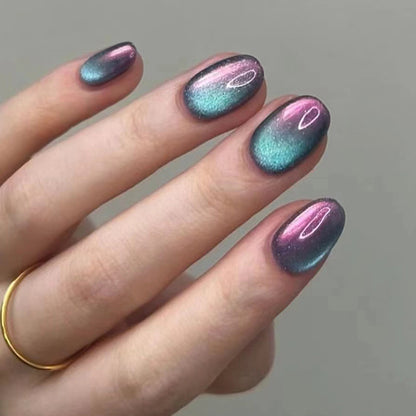 Cotton Candy cat eye nails featuring a soft pastel pink and blue gradient, enhanced by a mesmerizing cat eye effect that catches the light.