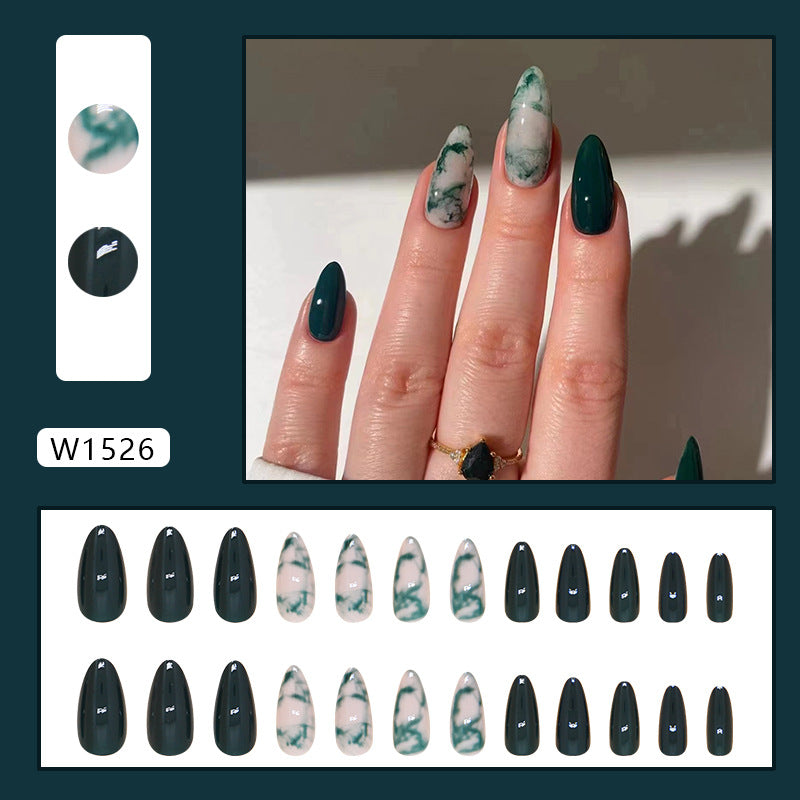 Elegant green marble nails with intricate swirling patterns in shades of green and white, perfect for a stylish, earthy look.