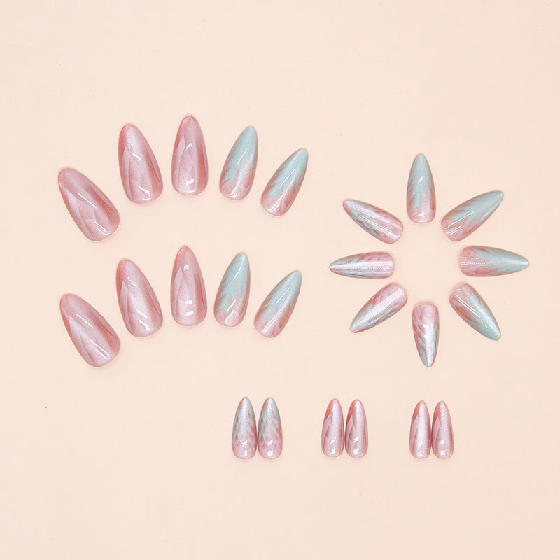 Stunning mermaid shell press-on nails with a pearly, holographic effect and delicate shell details, perfect for a beachy, whimsical vibe.