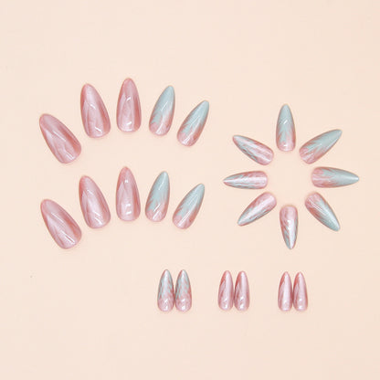 Stunning mermaid shell press-on nails with a pearly, holographic effect and delicate shell details, perfect for a beachy, whimsical vibe.