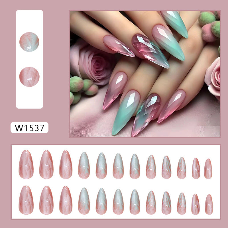 Press-on nails with a mermaid shell design, showcasing a mix of pastel colors and shimmer that capture the essence of the sea.