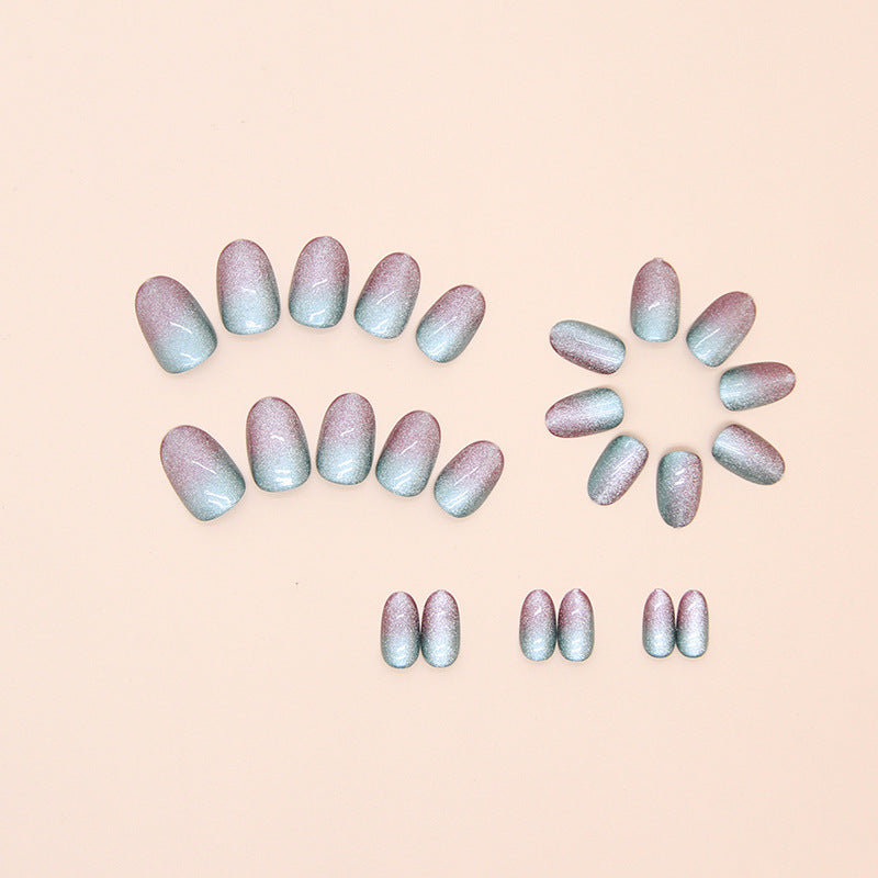 Stylish Cotton Candy cat eye nails adorned with a playful mix of pastel colors, creating a whimsical design that sparkles in the light